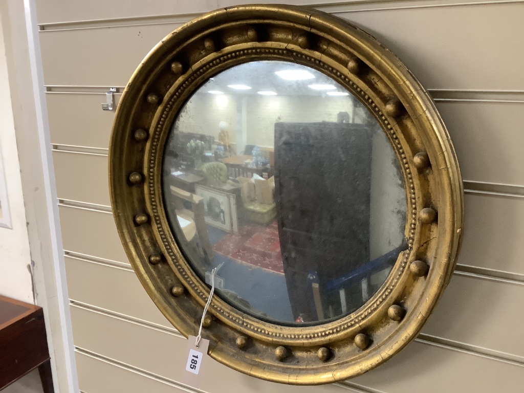 A Regency design gilt convex circular mirror, diameter 49cm